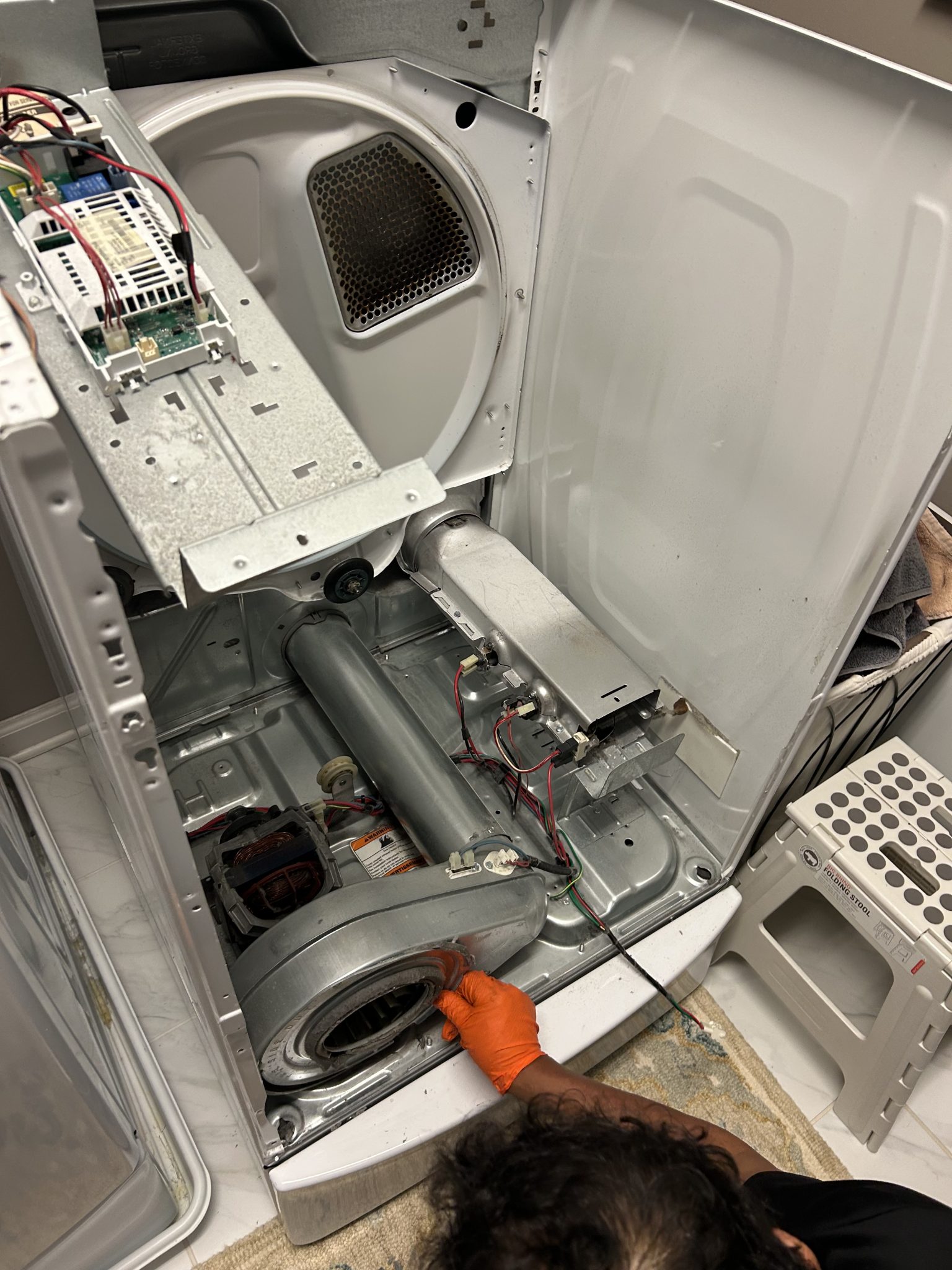 Dryer opened up for repair, drum removed